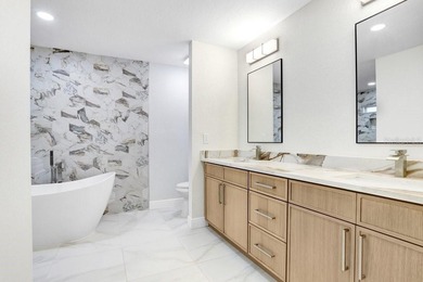 Nestled on a desirable corner lot in Feather Sound, this fully on Feather Sound Country Club in Florida - for sale on GolfHomes.com, golf home, golf lot