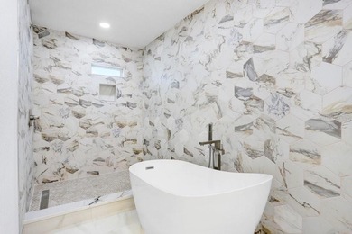 Nestled on a desirable corner lot in Feather Sound, this fully on Feather Sound Country Club in Florida - for sale on GolfHomes.com, golf home, golf lot