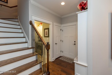 Situated along the fairways of the Woods Golf Course in on Whispering Woods in North Carolina - for sale on GolfHomes.com, golf home, golf lot