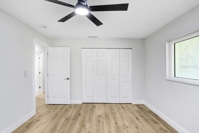 Nestled on a desirable corner lot in Feather Sound, this fully on Feather Sound Country Club in Florida - for sale on GolfHomes.com, golf home, golf lot