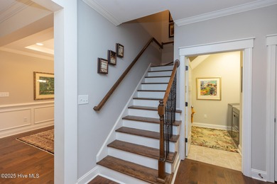 Situated along the fairways of the Woods Golf Course in on Whispering Woods in North Carolina - for sale on GolfHomes.com, golf home, golf lot