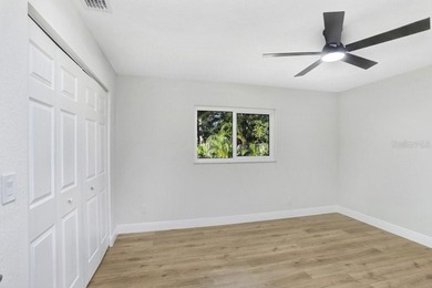 Nestled on a desirable corner lot in Feather Sound, this fully on Feather Sound Country Club in Florida - for sale on GolfHomes.com, golf home, golf lot