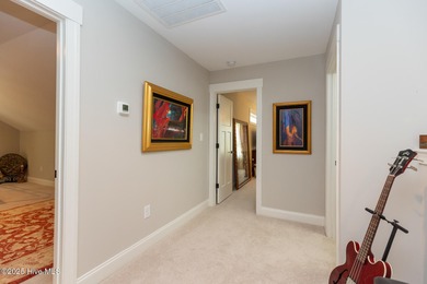 Situated along the fairways of the Woods Golf Course in on Whispering Woods in North Carolina - for sale on GolfHomes.com, golf home, golf lot