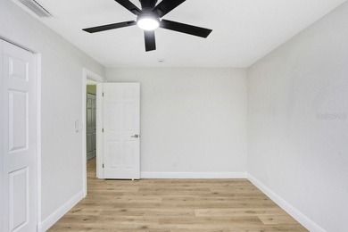 Nestled on a desirable corner lot in Feather Sound, this fully on Feather Sound Country Club in Florida - for sale on GolfHomes.com, golf home, golf lot