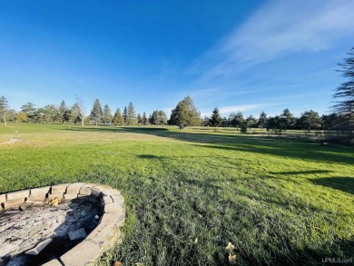 Discover the ideal blend of convenience and serenity with this on Highland Golf Club in Michigan - for sale on GolfHomes.com, golf home, golf lot