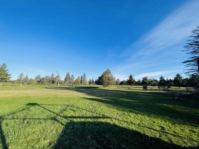 Discover the ideal blend of convenience and serenity with this on Highland Golf Club in Michigan - for sale on GolfHomes.com, golf home, golf lot