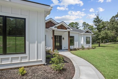 STUNNING MODERN LAKEFRONT HOME ON LAKE SINCLAIR! This sleek and on Milledgeville Country Club in Georgia - for sale on GolfHomes.com, golf home, golf lot