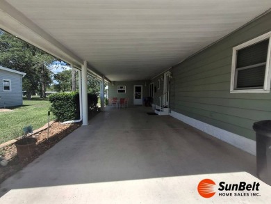 Corner Lot Gem with Golf Course Views in Rolling Greens Village! on Rolling Greens Executive Golf Community in Florida - for sale on GolfHomes.com, golf home, golf lot