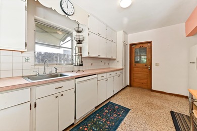 Single-family home located in the Historic District of Lake on Lake Worth Municipal Golf Course in Florida - for sale on GolfHomes.com, golf home, golf lot