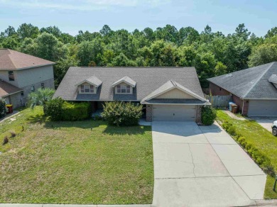 You'll blend with nature in this all brick, 3-bedroom, 2-bath on The Club At Hidden Creek in Florida - for sale on GolfHomes.com, golf home, golf lot