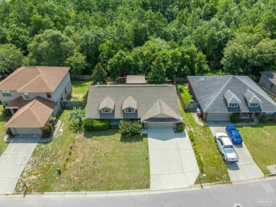 You'll blend with nature in this all brick, 3-bedroom, 2-bath on The Club At Hidden Creek in Florida - for sale on GolfHomes.com, golf home, golf lot