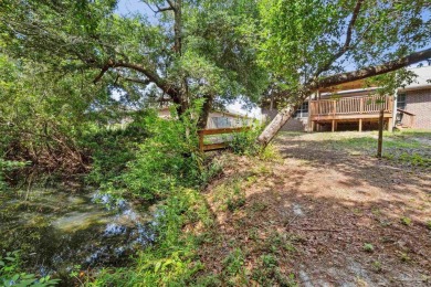 You'll blend with nature in this all brick, 3-bedroom, 2-bath on The Club At Hidden Creek in Florida - for sale on GolfHomes.com, golf home, golf lot