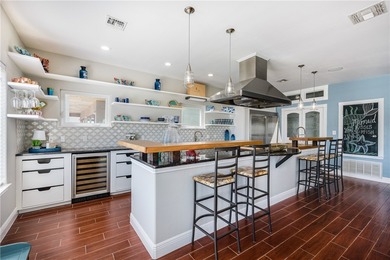 Stunning Waterfront Home on the Desirable Shady Side of Island on Palmilla Beach Golf Club in Texas - for sale on GolfHomes.com, golf home, golf lot