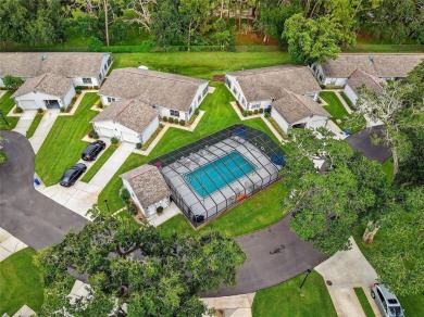Discover low-maintenance Florida living in this beautifully on Seven Springs Golf and Country Club in Florida - for sale on GolfHomes.com, golf home, golf lot