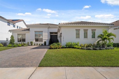 Step into luxury and elegance at 13916 Larkton Ln. This home is on Eagle Creek Golf Club in Florida - for sale on GolfHomes.com, golf home, golf lot