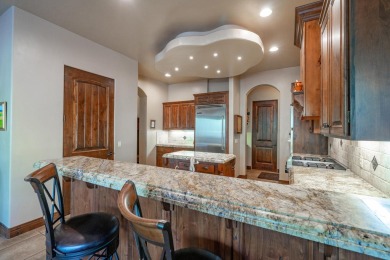 Experience luxurious living in this exquisite AJ Construction on Entrada at Snow Canyon in Utah - for sale on GolfHomes.com, golf home, golf lot