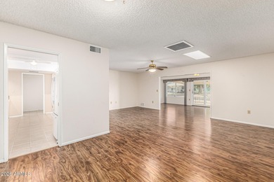 Welcome to relaxed desert living in the heart of Sun City, one on Sun City Lakes West and East in Arizona - for sale on GolfHomes.com, golf home, golf lot