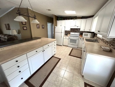 This bright home has been lovingly remodeled bringing modern on Crystal Lake Club in Florida - for sale on GolfHomes.com, golf home, golf lot