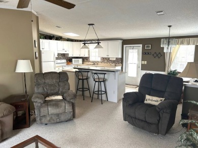 This bright home has been lovingly remodeled bringing modern on Crystal Lake Club in Florida - for sale on GolfHomes.com, golf home, golf lot