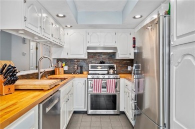 Nestled within the picturesque Louisquisset Golf Course on Louisquisset Golf Club in Rhode Island - for sale on GolfHomes.com, golf home, golf lot