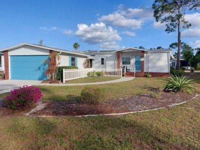 This artistic 2-bedroom 2-bathroom spacious home is located in a on Pine Lakes Country Club in Florida - for sale on GolfHomes.com, golf home, golf lot
