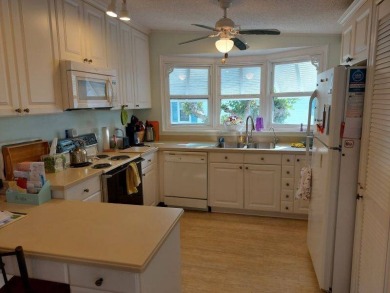 This artistic 2-bedroom 2-bathroom spacious home is located in a on Pine Lakes Country Club in Florida - for sale on GolfHomes.com, golf home, golf lot