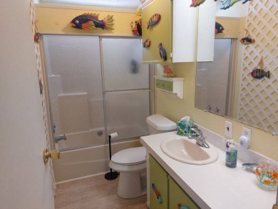 This artistic 2-bedroom 2-bathroom spacious home is located in a on Pine Lakes Country Club in Florida - for sale on GolfHomes.com, golf home, golf lot