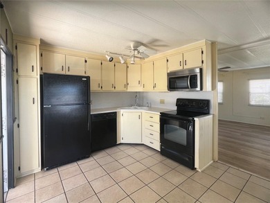 This charming double-wide home is ideally situated at the end of on Fairway Village Golf Course in Florida - for sale on GolfHomes.com, golf home, golf lot