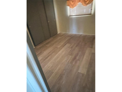 This charming double-wide home is ideally situated at the end of on Fairway Village Golf Course in Florida - for sale on GolfHomes.com, golf home, golf lot