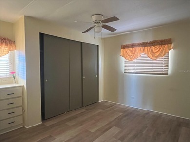 This charming double-wide home is ideally situated at the end of on Fairway Village Golf Course in Florida - for sale on GolfHomes.com, golf home, golf lot