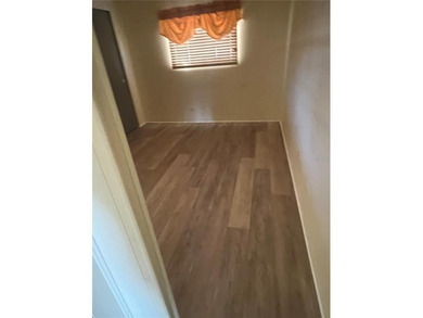 This charming double-wide home is ideally situated at the end of on Fairway Village Golf Course in Florida - for sale on GolfHomes.com, golf home, golf lot