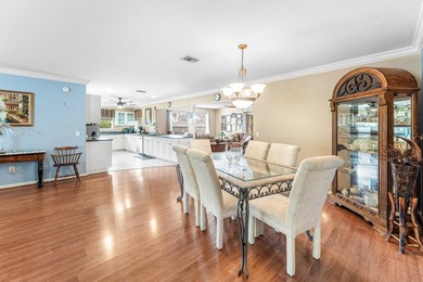 Enjoy easy Florida living in this well-cared-for 3-bedroom on Palm Beach National Golf and Country Club in Florida - for sale on GolfHomes.com, golf home, golf lot