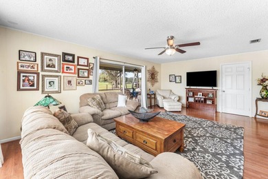 Enjoy easy Florida living in this well-cared-for 3-bedroom on Palm Beach National Golf and Country Club in Florida - for sale on GolfHomes.com, golf home, golf lot