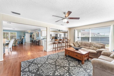 Enjoy easy Florida living in this well-cared-for 3-bedroom on Palm Beach National Golf and Country Club in Florida - for sale on GolfHomes.com, golf home, golf lot