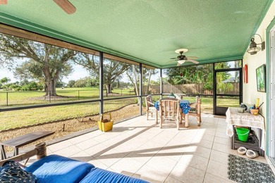 Enjoy easy Florida living in this well-cared-for 3-bedroom on Palm Beach National Golf and Country Club in Florida - for sale on GolfHomes.com, golf home, golf lot