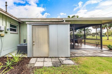 Enjoy easy Florida living in this well-cared-for 3-bedroom on Palm Beach National Golf and Country Club in Florida - for sale on GolfHomes.com, golf home, golf lot