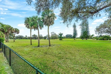Enjoy easy Florida living in this well-cared-for 3-bedroom on Palm Beach National Golf and Country Club in Florida - for sale on GolfHomes.com, golf home, golf lot