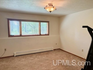 Awesome river setting with over 1,000' of Chocolay River on Northern Michigan University Golf Course (NMU) in Michigan - for sale on GolfHomes.com, golf home, golf lot