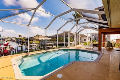 Welcome to paradise in Southwest Cape Coral! This luxurious on Royal Tee Country Club in Florida - for sale on GolfHomes.com, golf home, golf lot