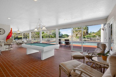 Set on 1.25 acres directly across from PGA National, this estate on  in Florida - for sale on GolfHomes.com, golf home, golf lot