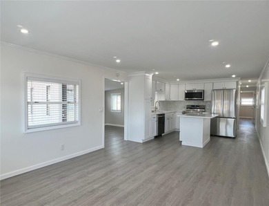 Welcome home to a truly exceptional renovation where modern on Fairway Village Golf Course in Florida - for sale on GolfHomes.com, golf home, golf lot