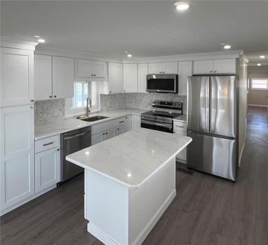 Welcome home to a truly exceptional renovation where modern on Fairway Village Golf Course in Florida - for sale on GolfHomes.com, golf home, golf lot