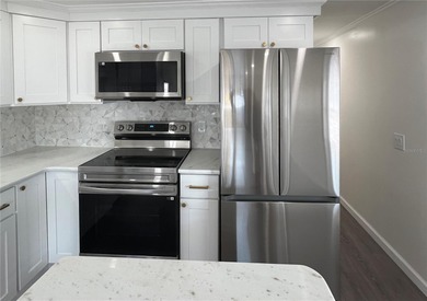 Welcome home to a truly exceptional renovation where modern on Fairway Village Golf Course in Florida - for sale on GolfHomes.com, golf home, golf lot