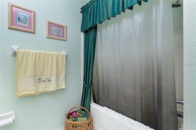 MOVE RIGHT IN to this IMMACULATE second floor unit, with a on Sabal Trace Golf and Country Club in Florida - for sale on GolfHomes.com, golf home, golf lot