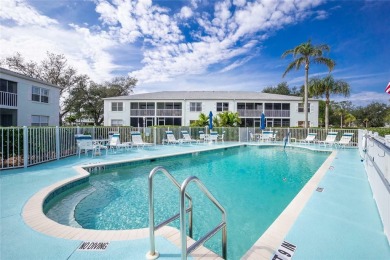 MOVE RIGHT IN to this IMMACULATE second floor unit, with a on Sabal Trace Golf and Country Club in Florida - for sale on GolfHomes.com, golf home, golf lot