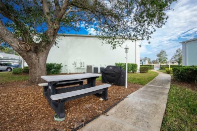 MOVE RIGHT IN to this IMMACULATE second floor unit, with a on Sabal Trace Golf and Country Club in Florida - for sale on GolfHomes.com, golf home, golf lot