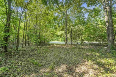 Build your dream retreat on this prime .63-acre parcel nestled on Wequetonsing Golf Course in Michigan - for sale on GolfHomes.com, golf home, golf lot