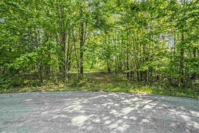 Build your dream retreat on this prime .63-acre parcel nestled on Wequetonsing Golf Course in Michigan - for sale on GolfHomes.com, golf home, golf lot