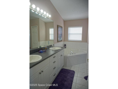 This 3 bedroom 2 bathroom home with high ceilings and relaxing on Majors Golf Club At Bayside Lakes in Florida - for sale on GolfHomes.com, golf home, golf lot