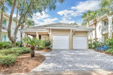 Experience coastal luxury at Sunshine Retreat nestled in the on Regatta Bay Golf and Country Club in Florida - for sale on GolfHomes.com, golf home, golf lot